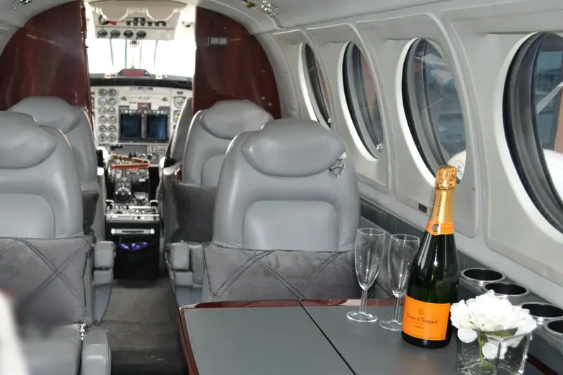 Beechcraft King Air 200 cabin with club seating, looking towards the flight deck