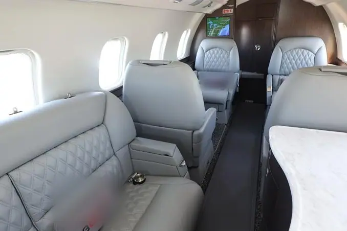 Bombardier Learjet 60 cabin with a divan and club seats