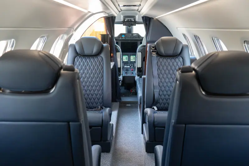 Embraer Phenom 300E cabin, looking towards the flight deck