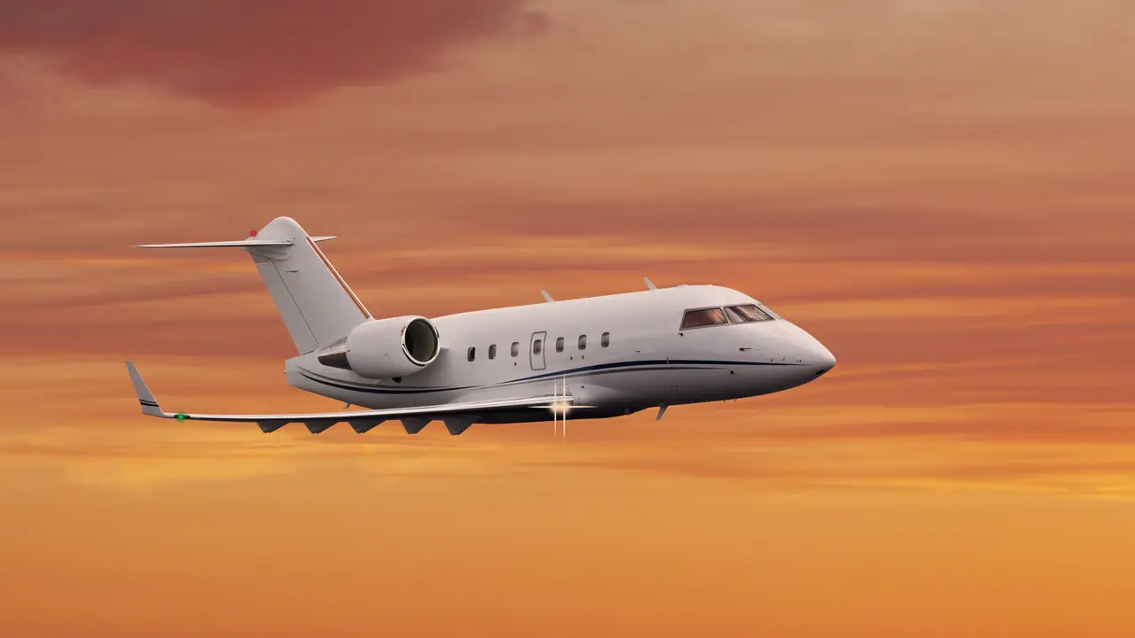 Private jet in flight at sunset